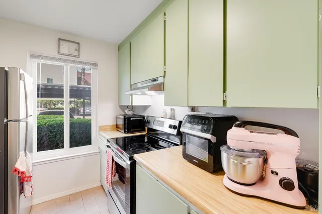 a kitchen with a stove and a microwave