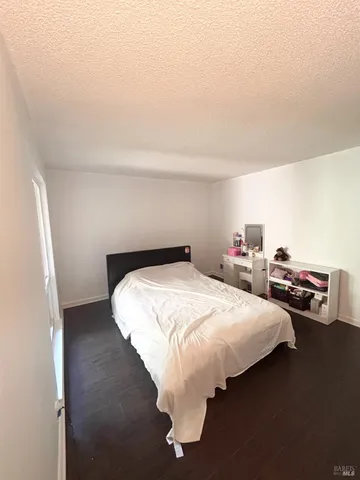 a bedroom with bed and a window