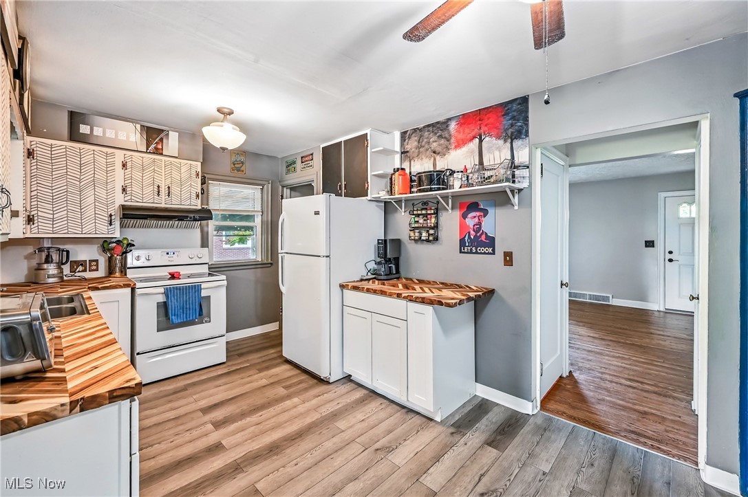 351 Niles Vienna Road Vienna, OH 44473 - Photo 6 of 30 Kitchen with herringbone style butcher block countertops, white appliances