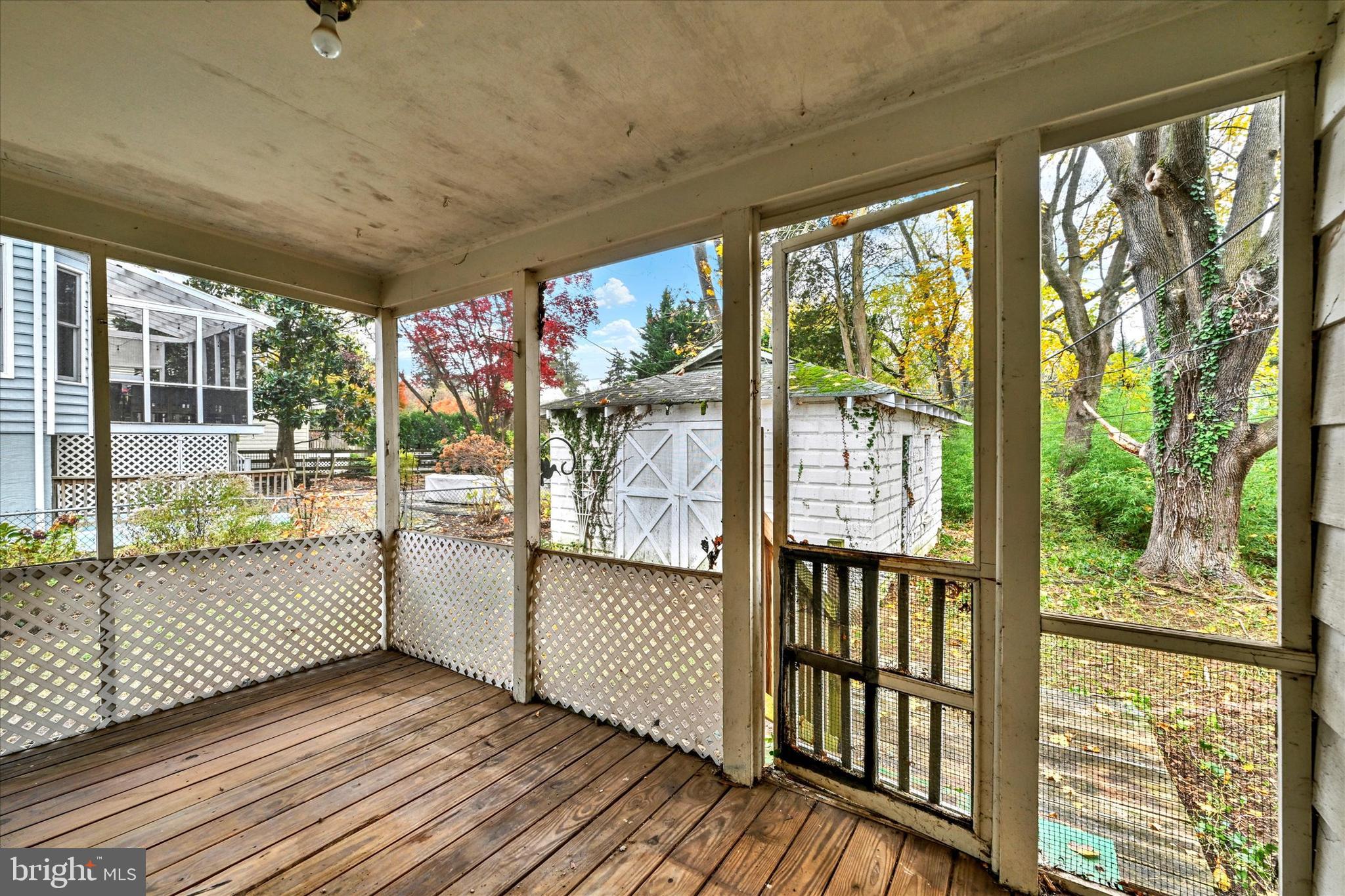 12 Decatur Avenue Annapolis, MD 21403 - Photo 16 of 21 a view of a porch with wooden floor and floor to ceiling windows