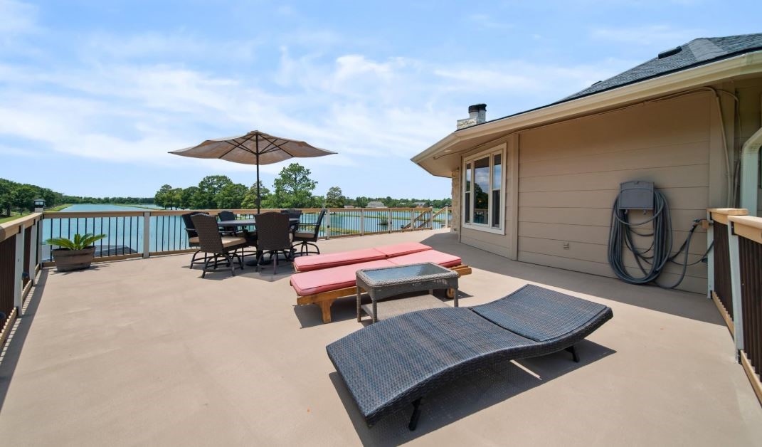 6714 Spray Lane, Unit C699A Rosharon, TX 77583 - Photo 35 of 48 Opposite Side of the 3rd Floor Deck is right off the Kitchen & perfect for Outdoor Lunches & Lounging. Again that LAKE View will always be on point!