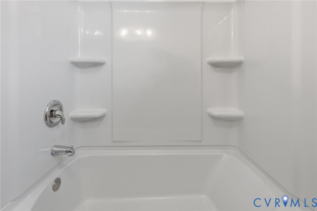 5116 Alberene Road Richmond, VA 23224 - Photo 14 of 20 a close up of a bathtub
