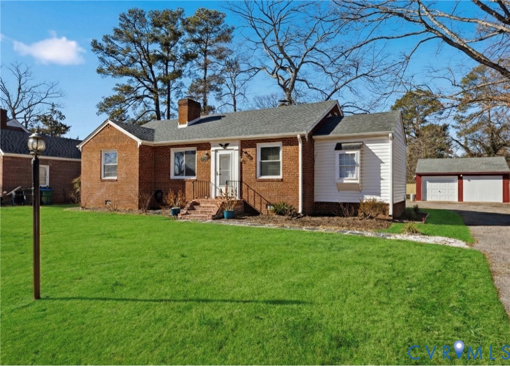 5116 Alberene Road Richmond, VA 23224 - Photo 20 of 20 a front view of house with yard and green space