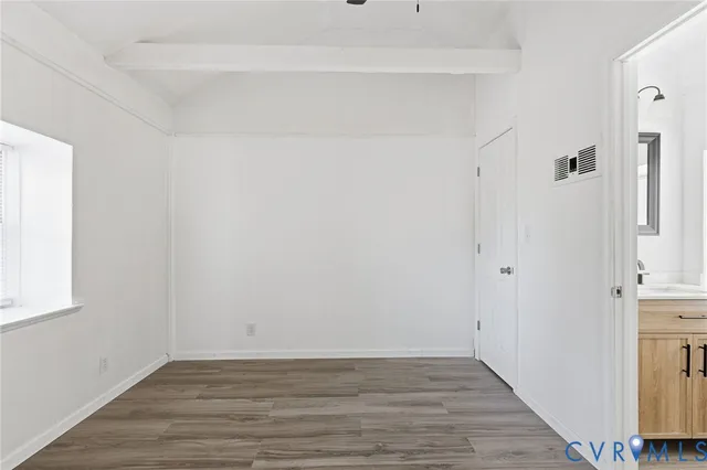 a bathroom with a sink a vanity and a large mirror