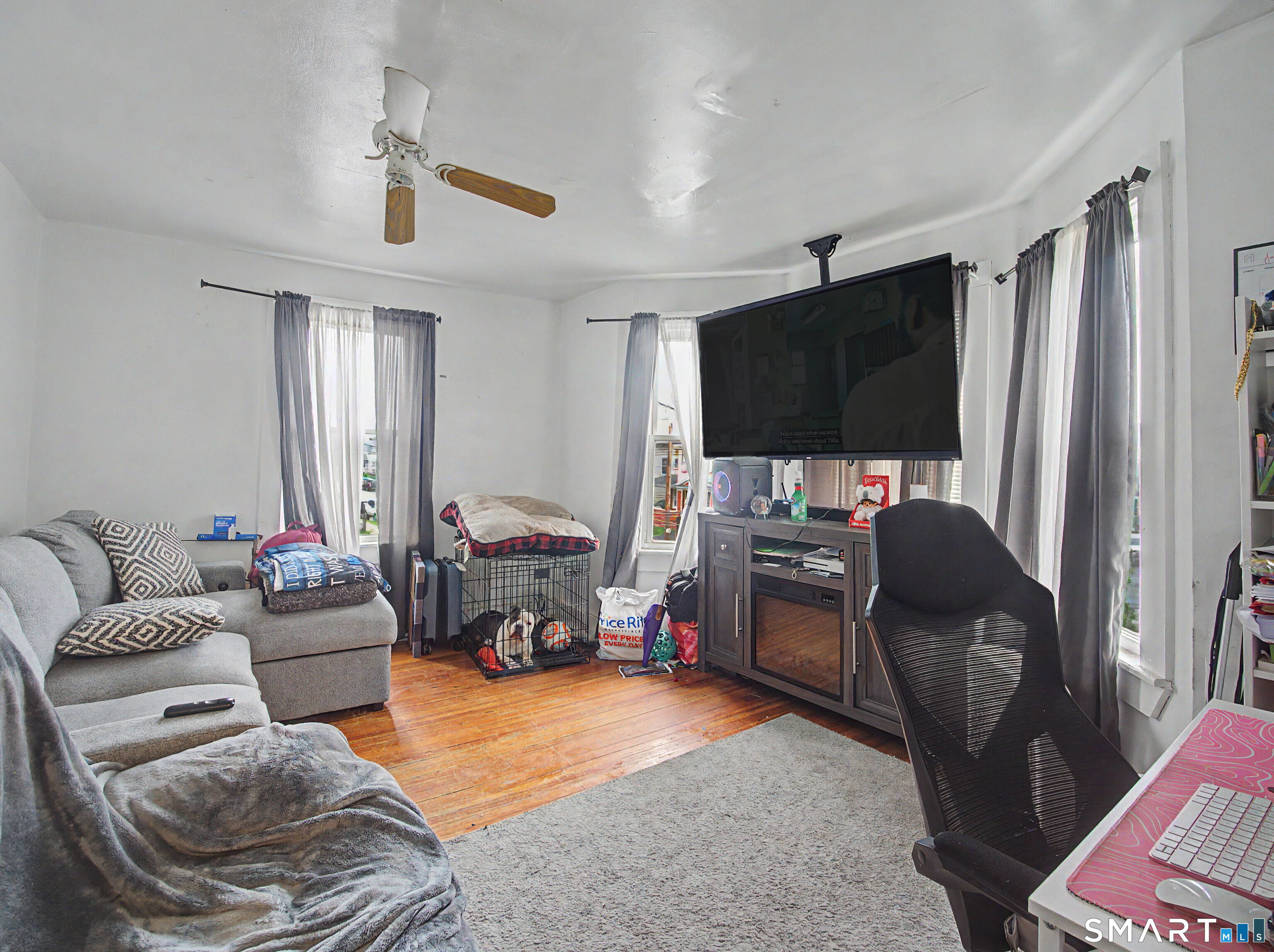 319 Carroll Avenue Bridgeport, CT 06607 - Photo 21 of 40 a living room with furniture and a flat screen tv