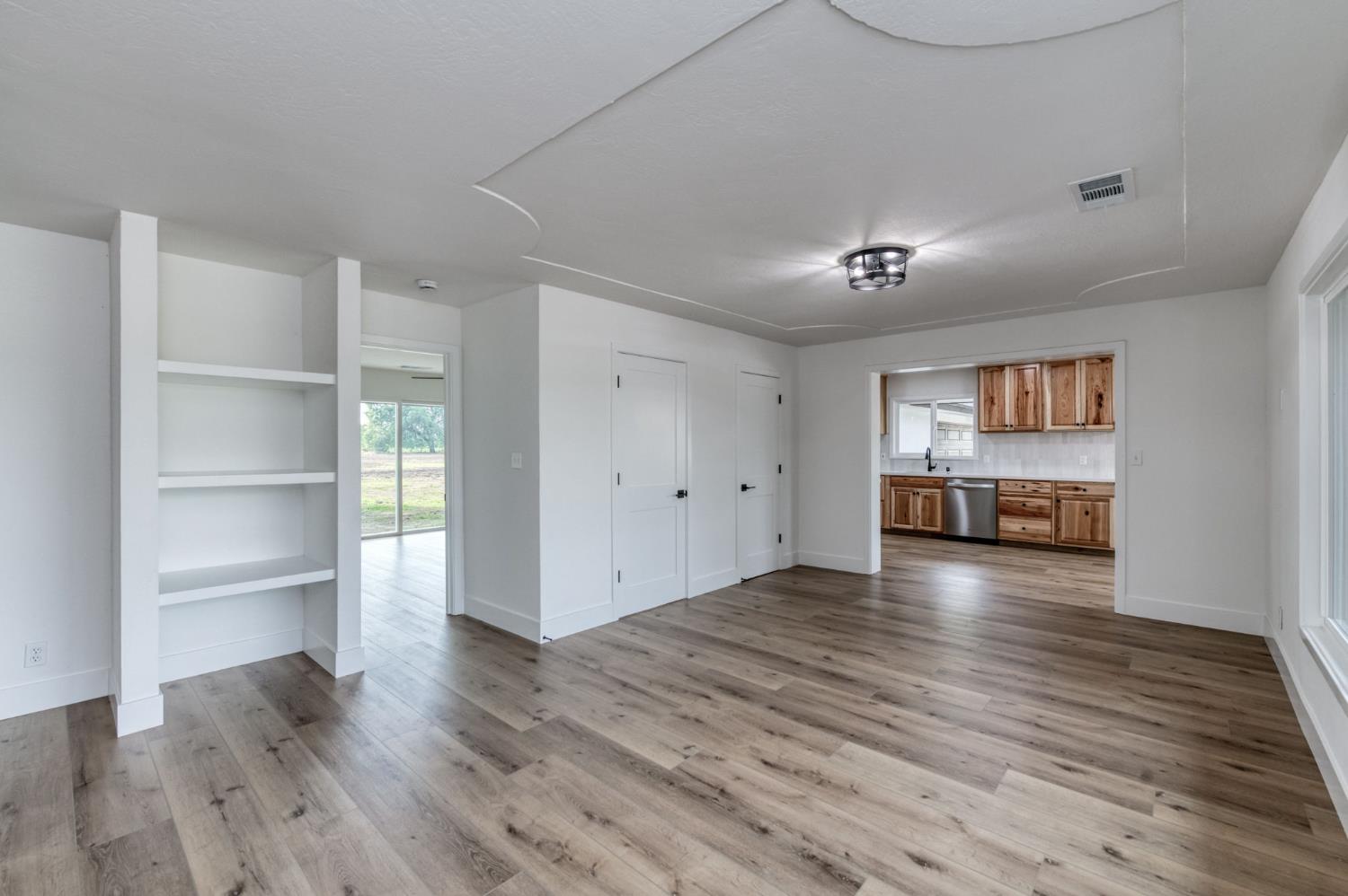 545 North Rio Vista Avenue Sanger, CA 93657 - Photo 13 of 46 a view of a room with wooden floor and closet