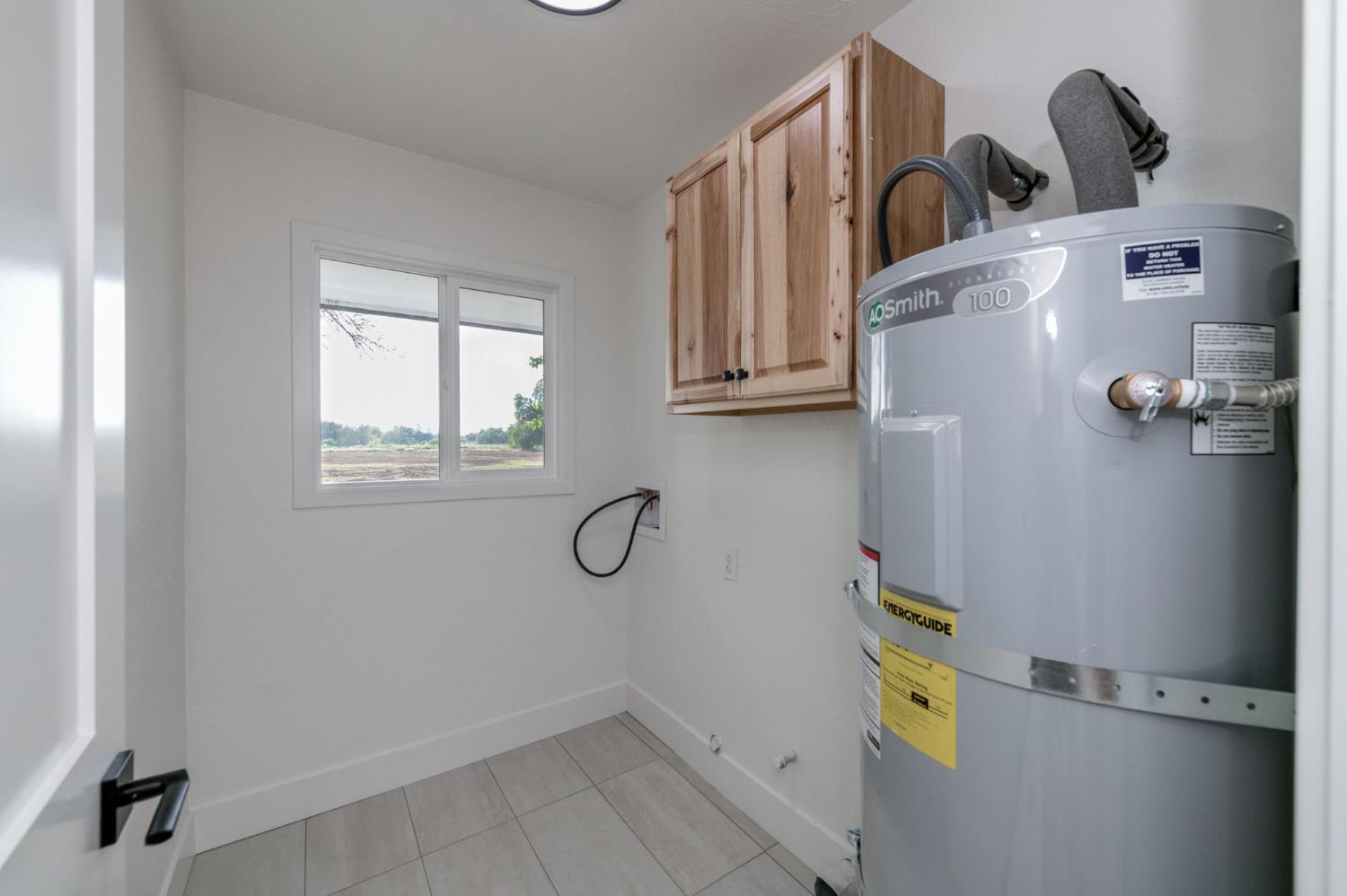 545 North Rio Vista Avenue Sanger, CA 93657 - Photo 17 of 46 a view of storage and utility room with racks on the wall