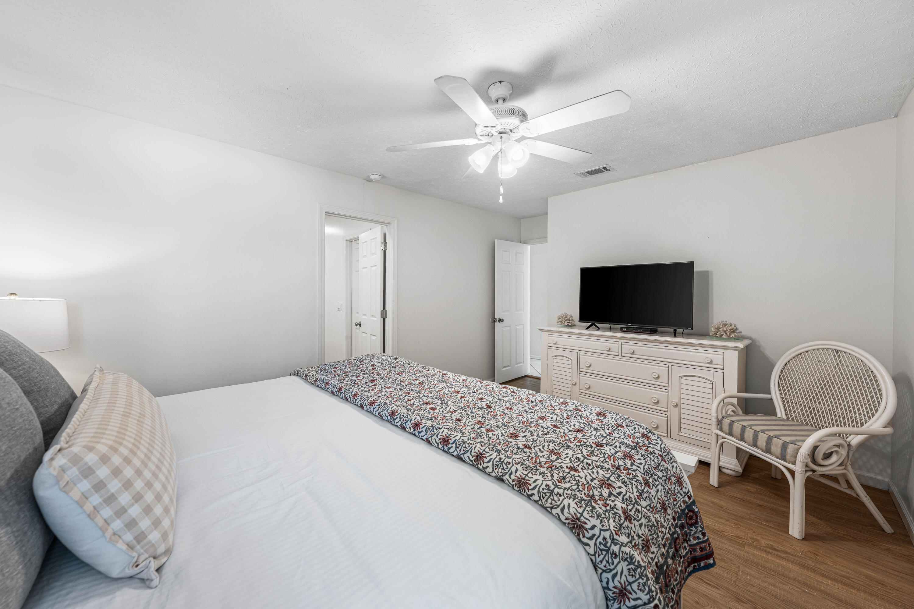 142 Beachside Drive, Unit 7 Santa Rosa Beach, FL 32459 - Photo 18 of 41 a bedroom with a bed and a flat screen tv