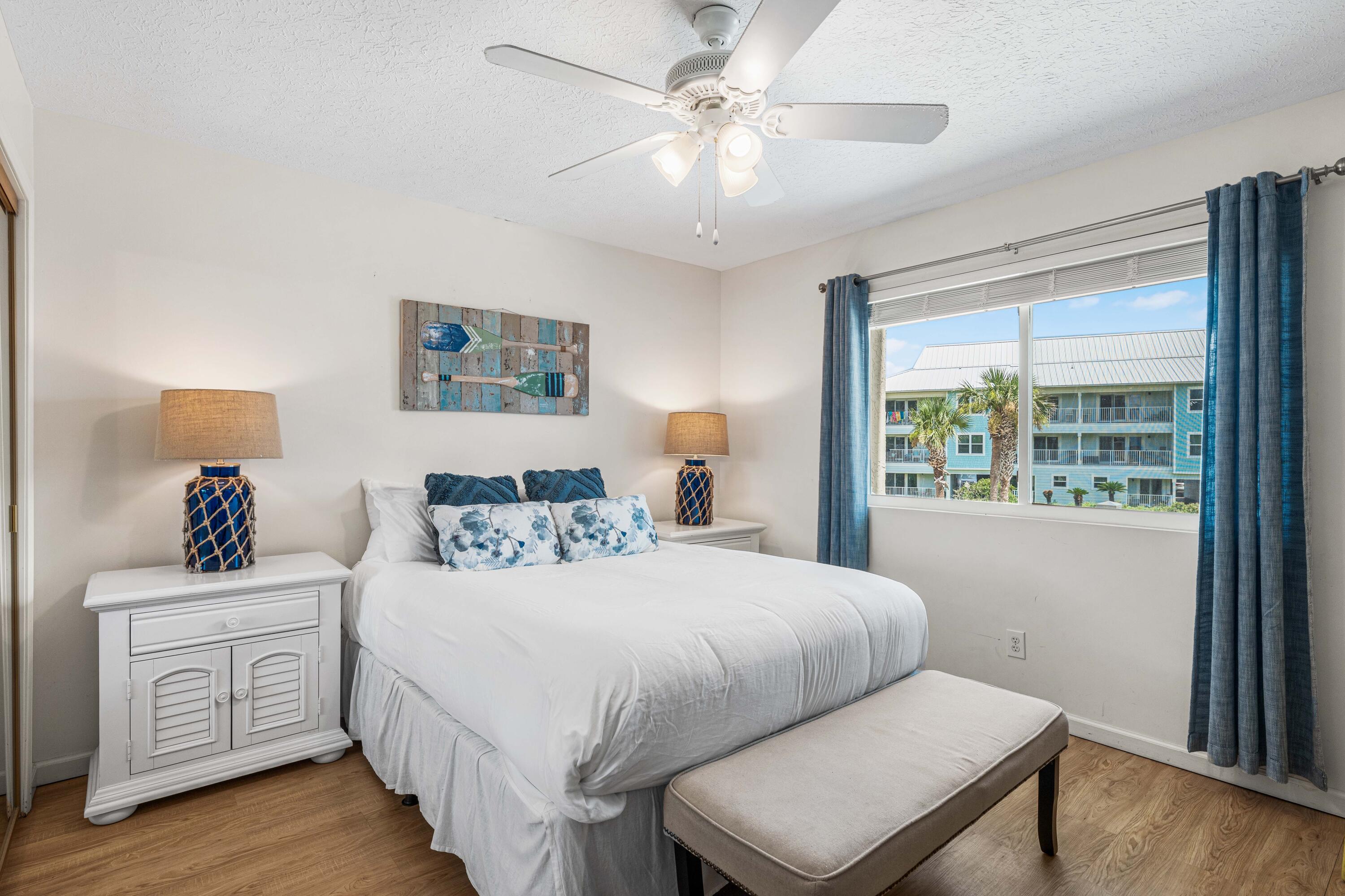142 Beachside Drive, Unit 7 Santa Rosa Beach, FL 32459 - Photo 24 of 41 a bedroom with a large bed and a window