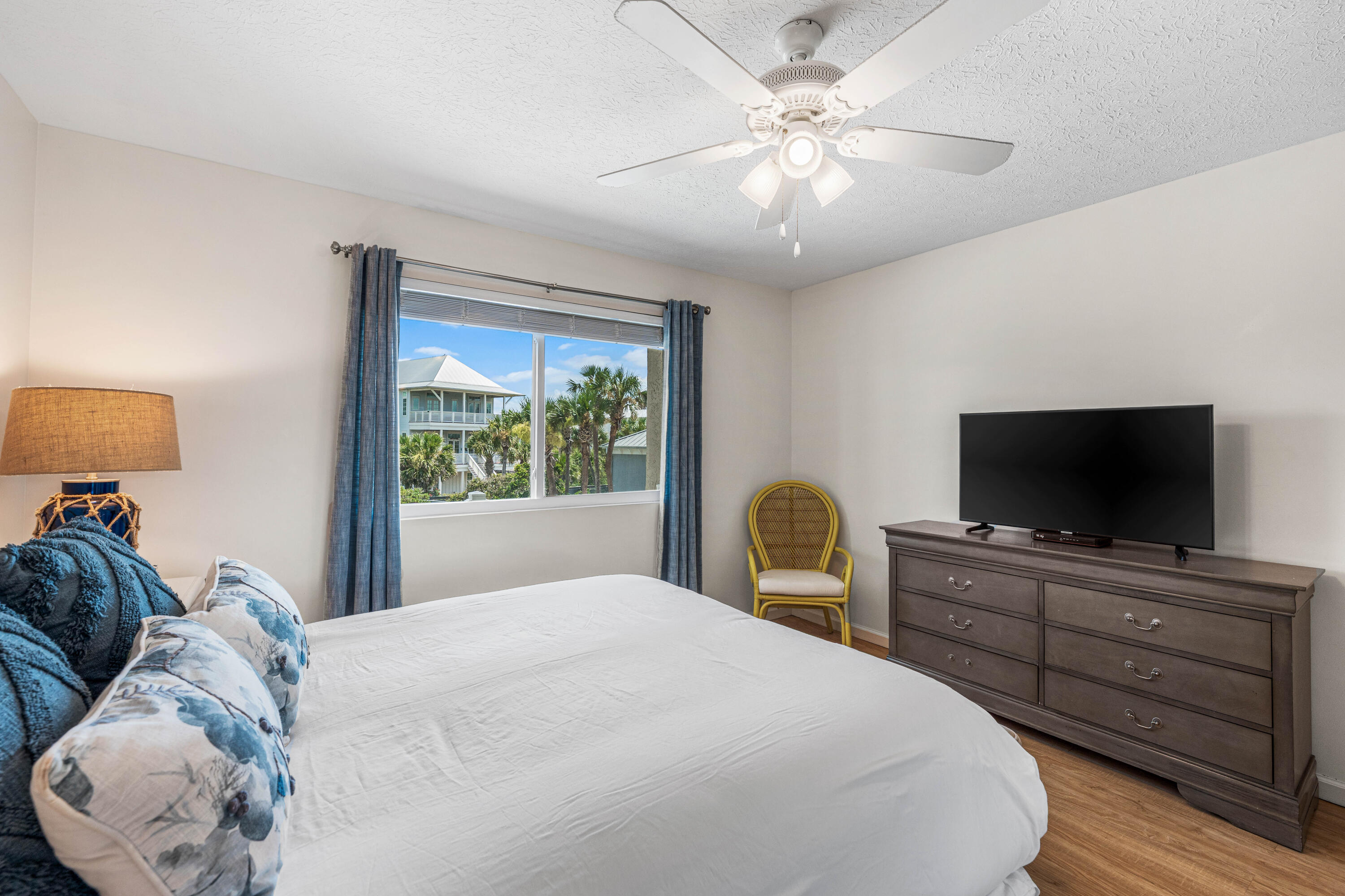 142 Beachside Drive, Unit 7 Santa Rosa Beach, FL 32459 - Photo 25 of 41 a bedroom with a bed and a flat screen tv