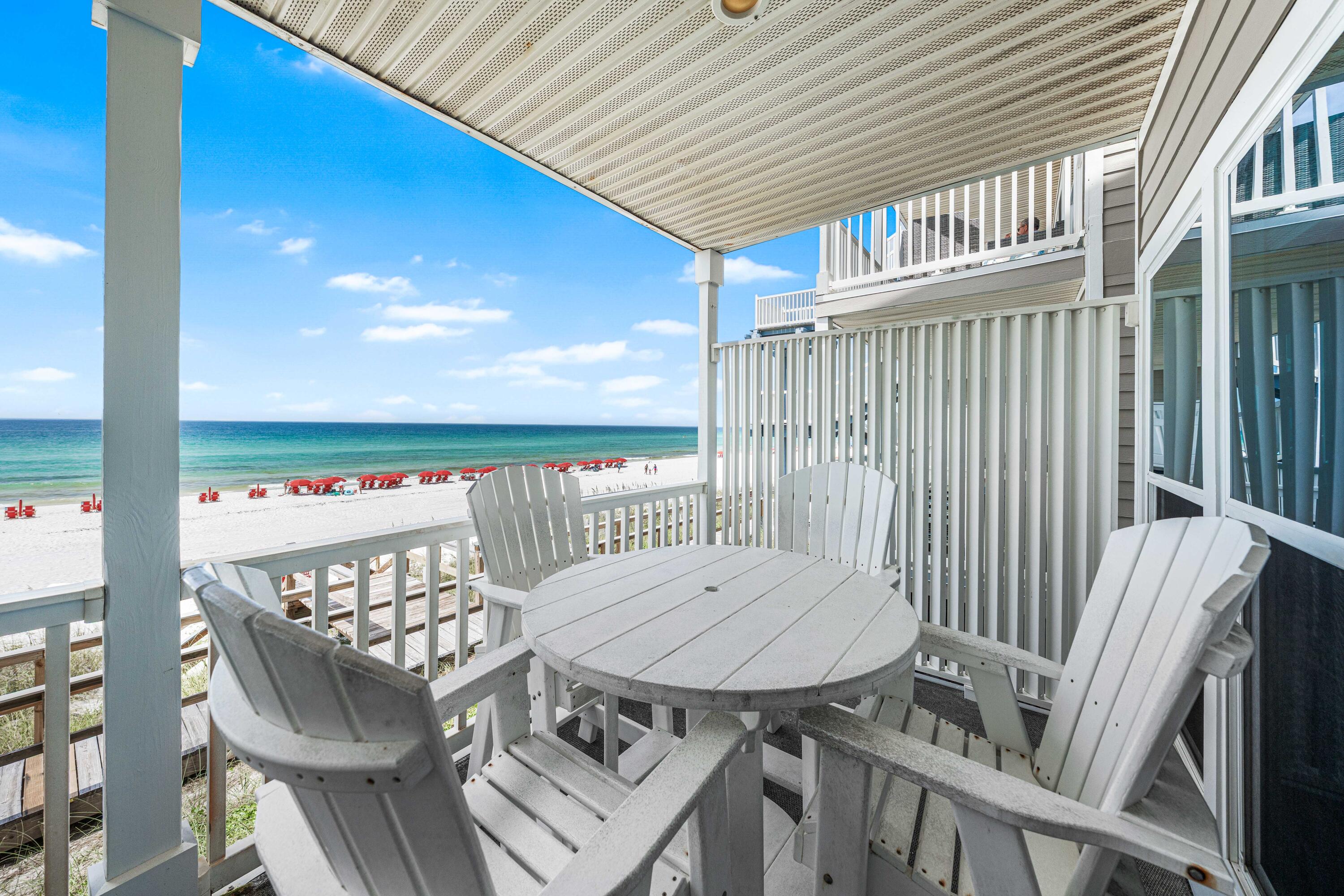 142 Beachside Drive, Unit 7 Santa Rosa Beach, FL 32459 - Photo 31 of 41 a view of a chairs and table in patio