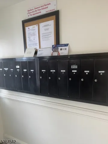 a bathroom with a granite countertop sink vanity and mirror