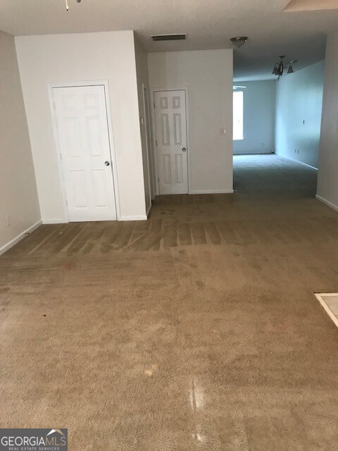 2320 Coach Way Jonesboro, GA 30236 - Photo 4 of 6 an empty room with a natural light