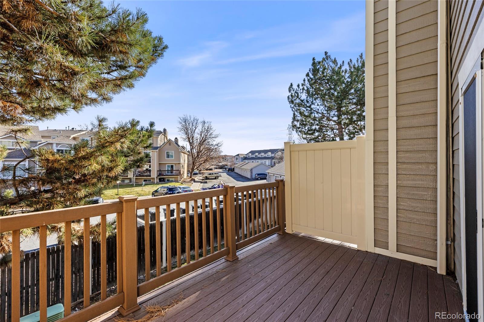 1811 South Quebec Way, Unit 82 Denver, CO 80231 - Photo 16 of 35 a view of a balcony with wooden fence