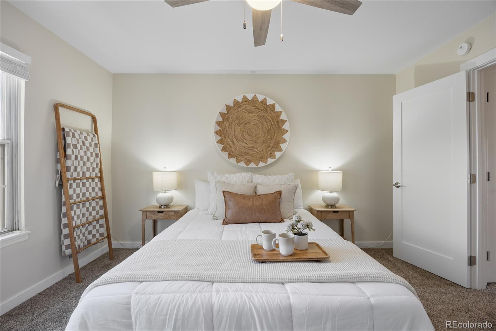 1811 South Quebec Way, Unit 82 Denver, CO 80231 - Photo 18 of 35 a bedroom with a bed and a potted plant