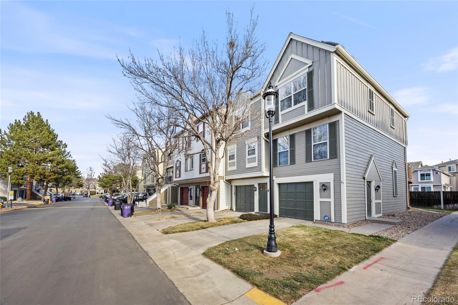 1811 South Quebec Way, Unit 82 Denver, CO 80231 - Photo 2 of 35 a front view of a building with street view