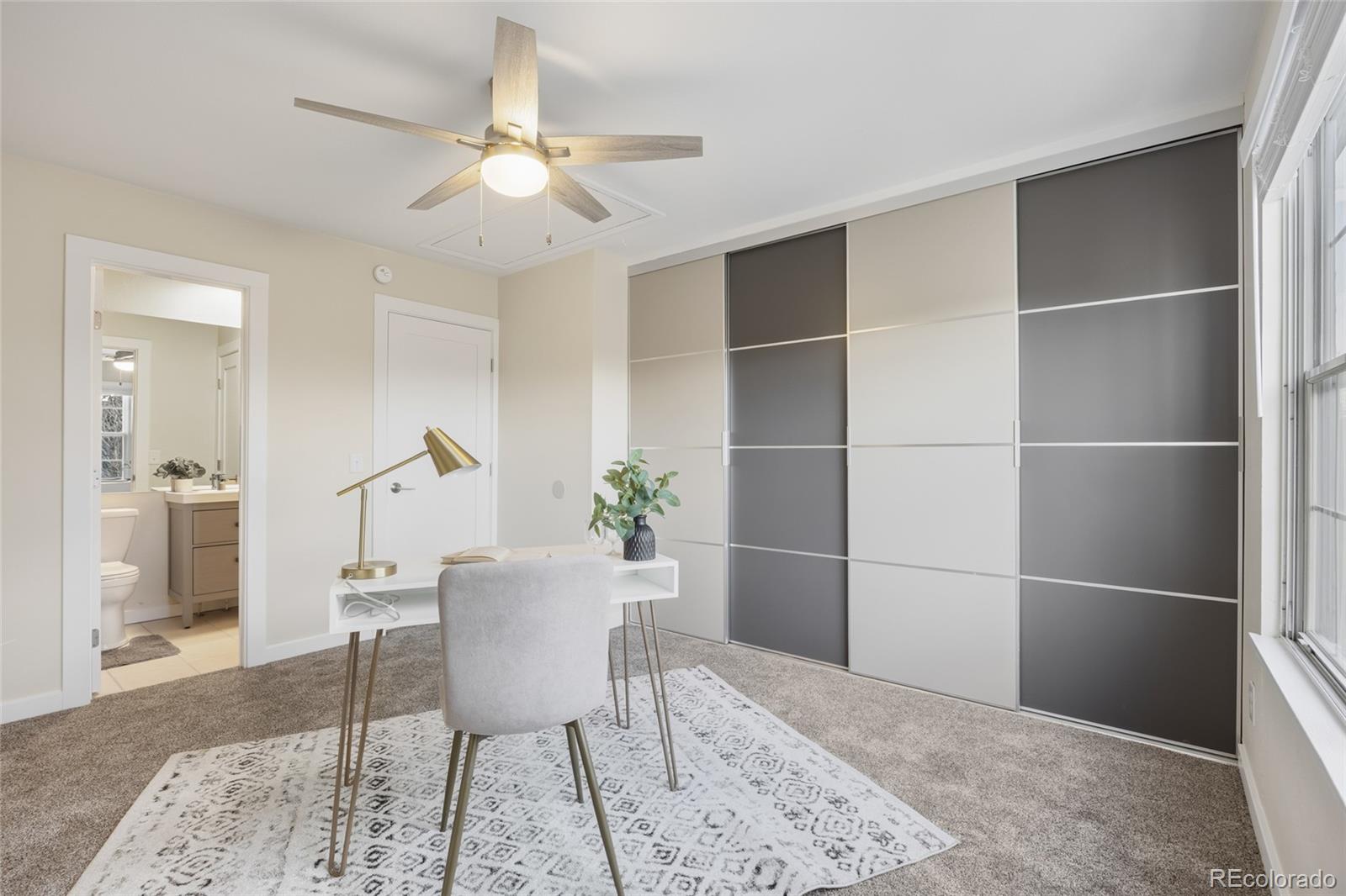 1811 South Quebec Way, Unit 82 Denver, CO 80231 - Photo 22 of 35 a view of a livingroom with a dinning table and chair