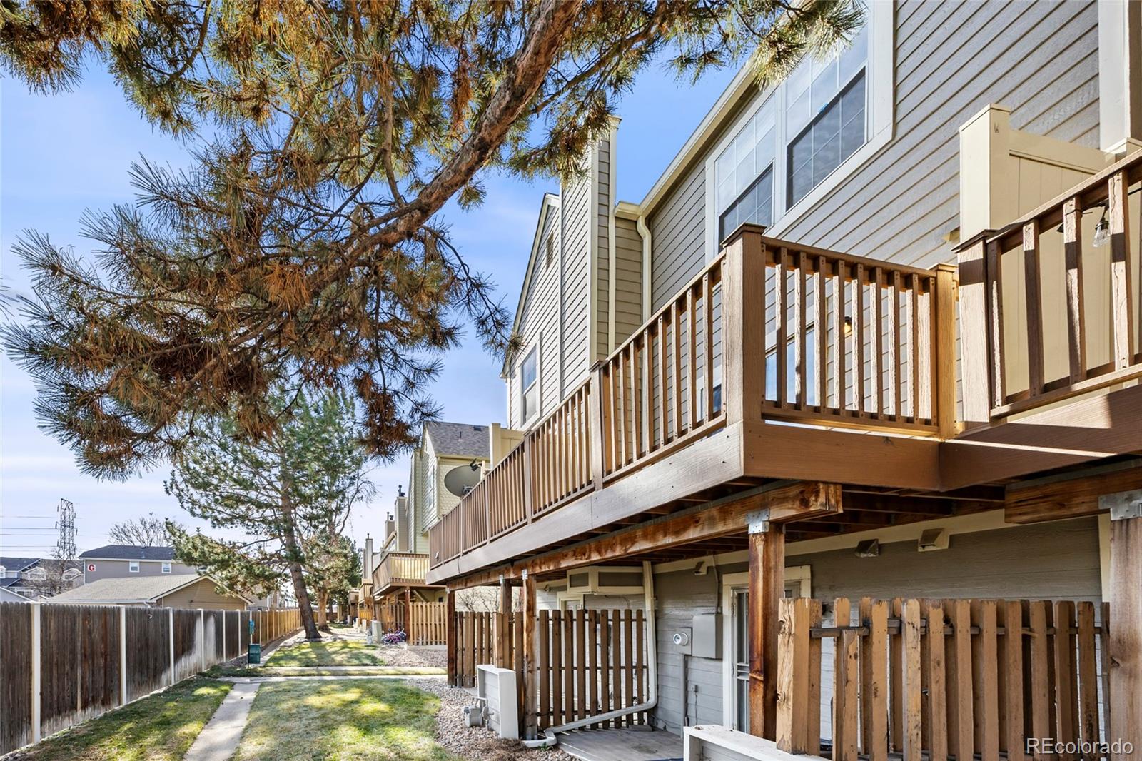 1811 South Quebec Way, Unit 82 Denver, CO 80231 - Photo 29 of 35 a front view of a house with a yard