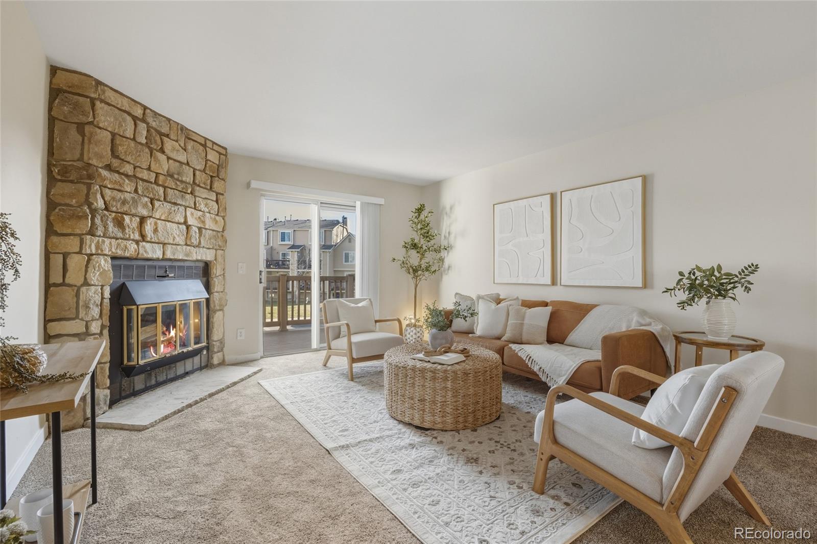 1811 South Quebec Way, Unit 82 Denver, CO 80231 - Photo 7 of 35 a living room with furniture and a fireplace