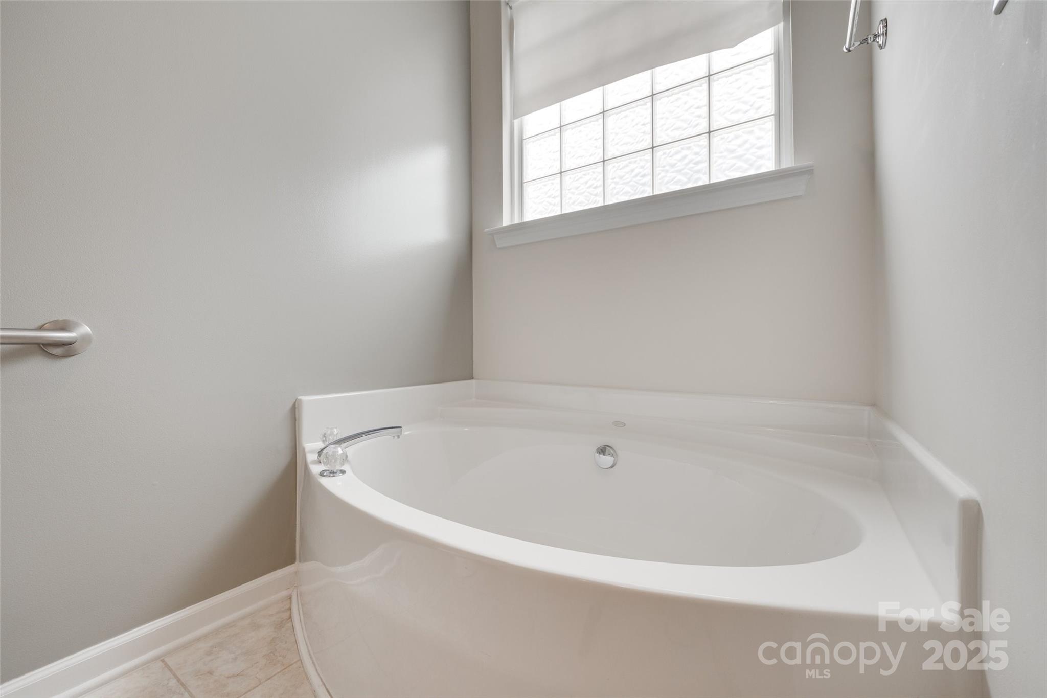 422 Garnet Court Fort Mill, SC 29708 - Photo 23 of 45 a white bath tub sitting in a bathroom