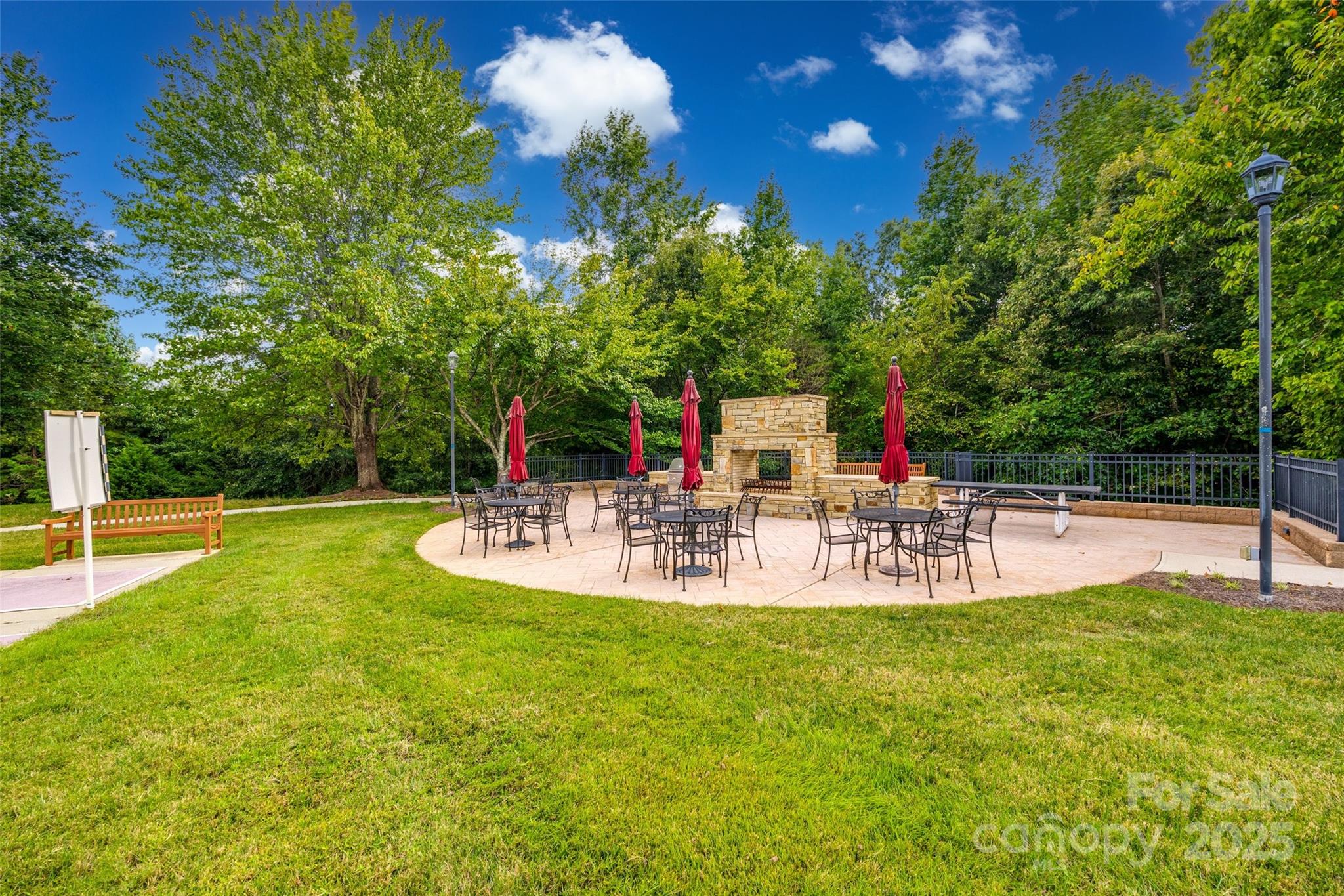 422 Garnet Court Fort Mill, SC 29708 - Photo 41 of 45 a view of a chairs and table with swimming pool