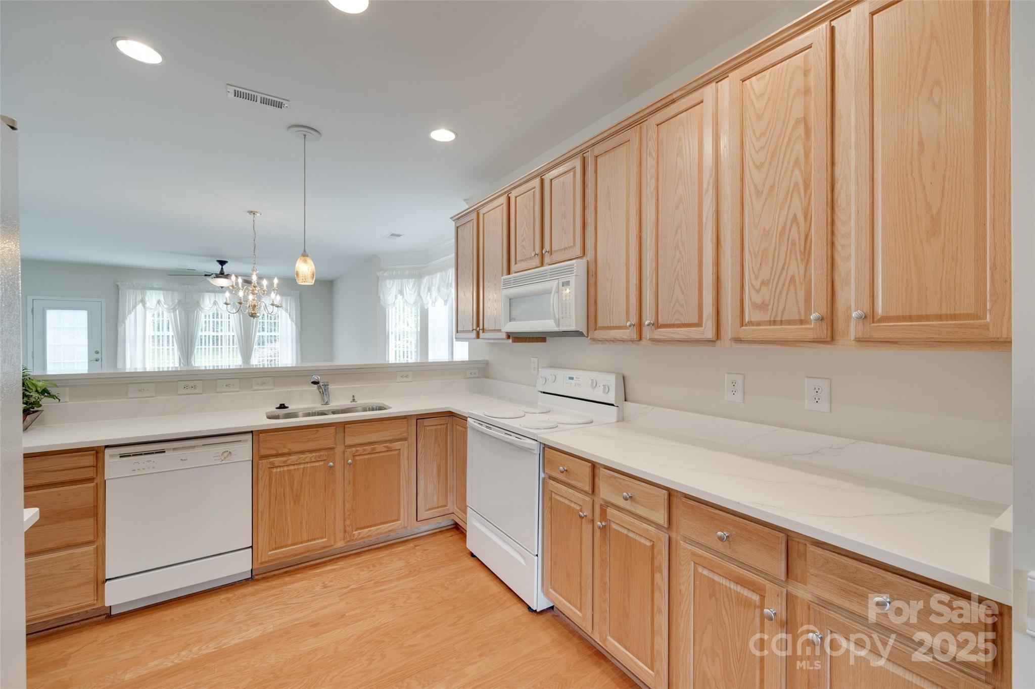 422 Garnet Court Fort Mill, SC 29708 - Photo 7 of 45 a kitchen with a sink cabinets and window