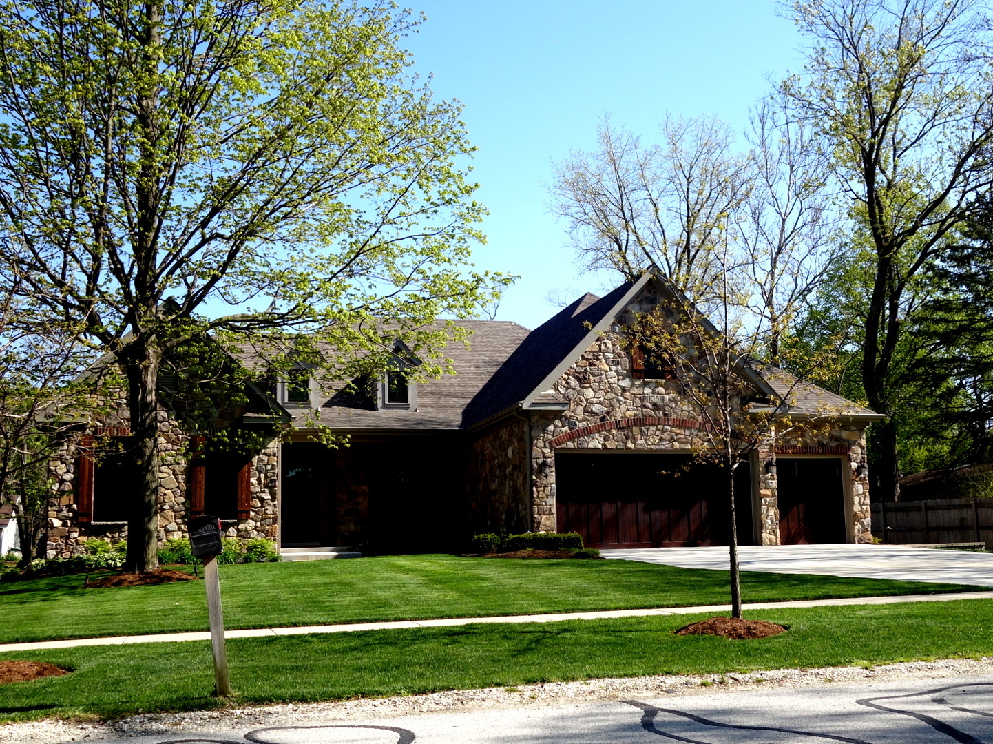 1051 Parkside Road Naperville, IL 60540 - Photo 1 of 52 a view of a white house in a big yard with large trees