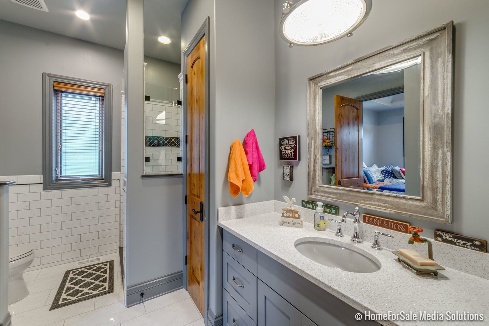 1051 Parkside Road Naperville, IL 60540 - Photo 18 of 52 a bathroom with a sink and a mirror