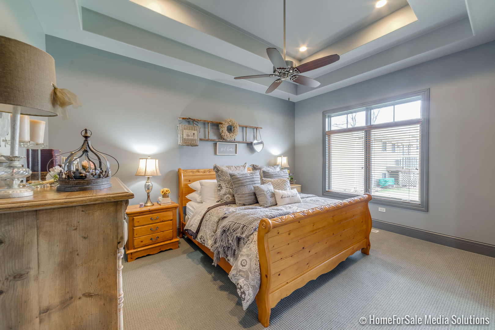 1051 Parkside Road Naperville, IL 60540 - Photo 21 of 52 a bed sitting in a spacious bedroom next to a window and a chandelier