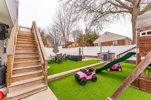 a childrens park with lots of swings and slides
