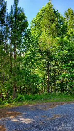 a view of a wooden fence next to a yard