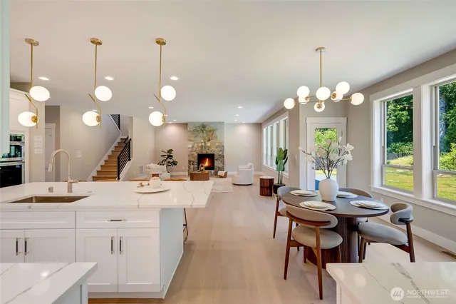a large kitchen with a table and chairs