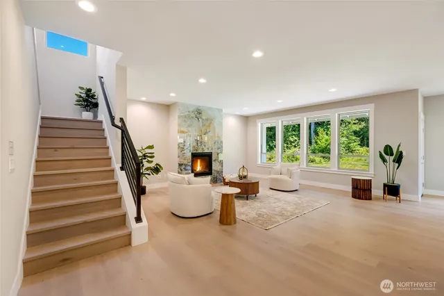 a living room with furniture and large windows
