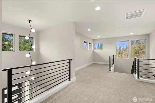 a view of an empty room and a window