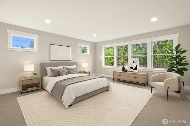 a spacious bedroom with a bed and a large window