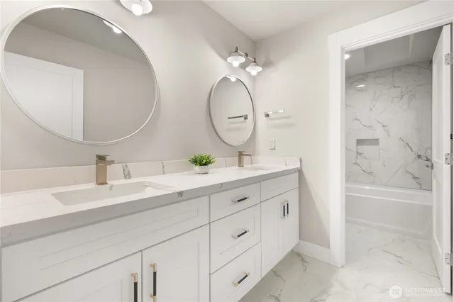 a bathroom with a double vanity sink mirror and shower