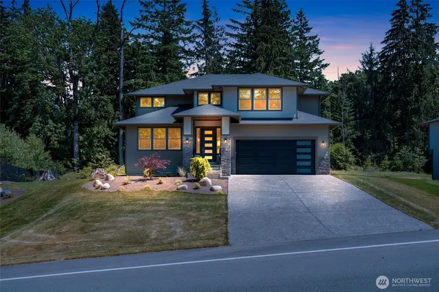 a front view of a house with yard