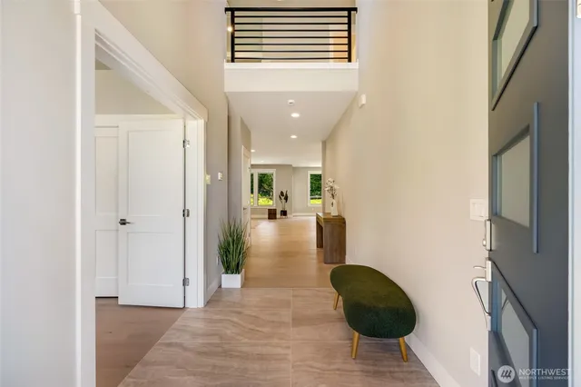 a view of entryway and hall with a window