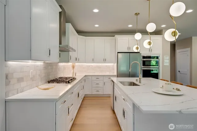 a kitchen that has a lot of cabinets in it