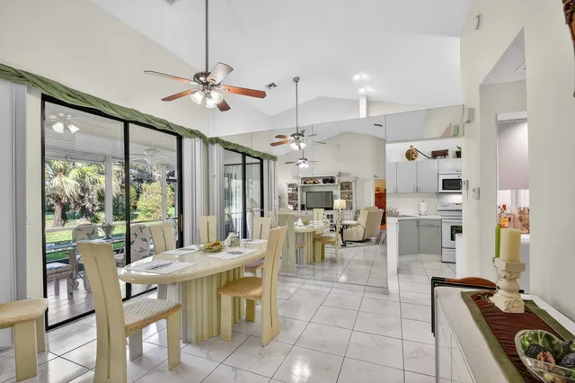 a kitchen with sink a microwave and cabinets