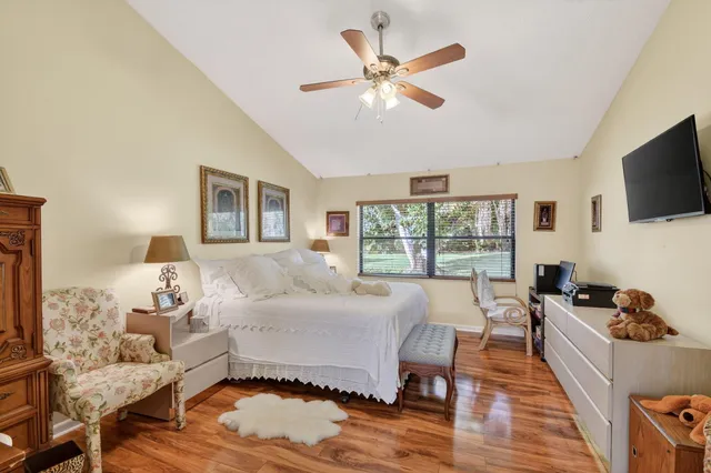 a bedroom with a bed and a mirror