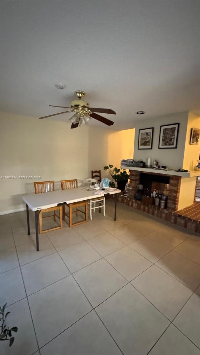15039 Southwest 89th Ter Road Miami, FL 33196 - Photo 19 of 21 a view of a livingroom with furniture and a ceiling fan