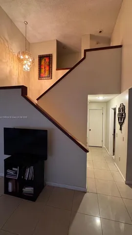 a view of a windows and chandelier in a room