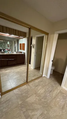 a view of an empty room with stairs