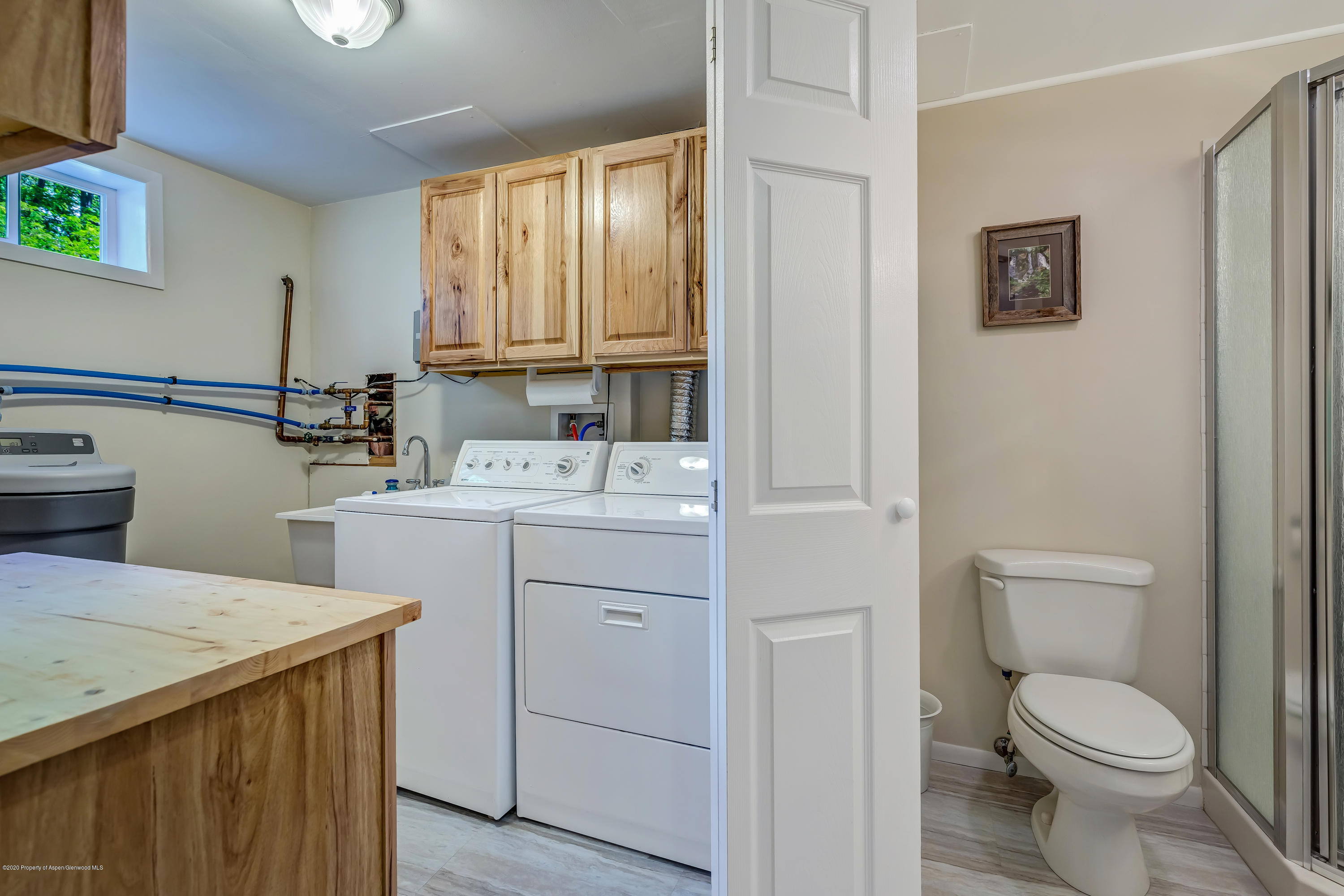 217 Ash Avenue Rifle, CO 81650 - Photo 14 of 25 a bathroom with a sink toilet vanity and window