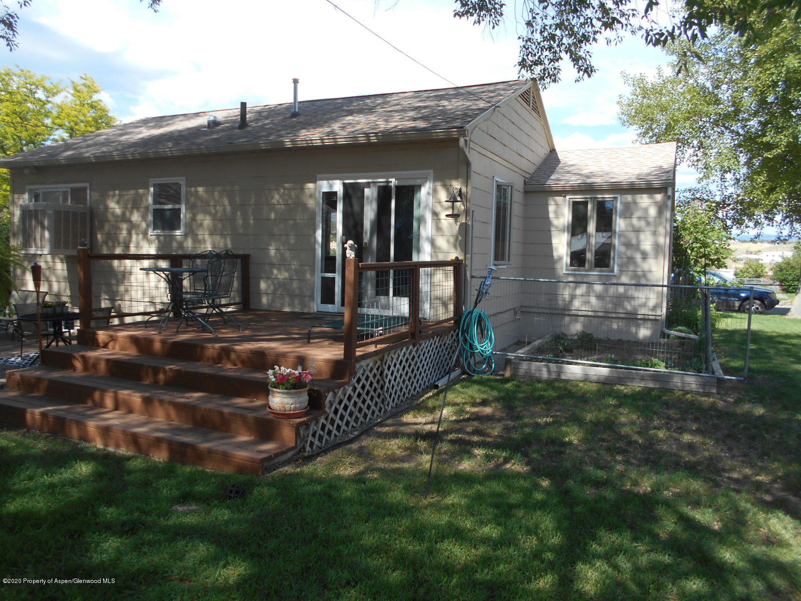 217 Ash Avenue Rifle, CO 81650 - Photo 19 of 25 a front view of a house with a yard