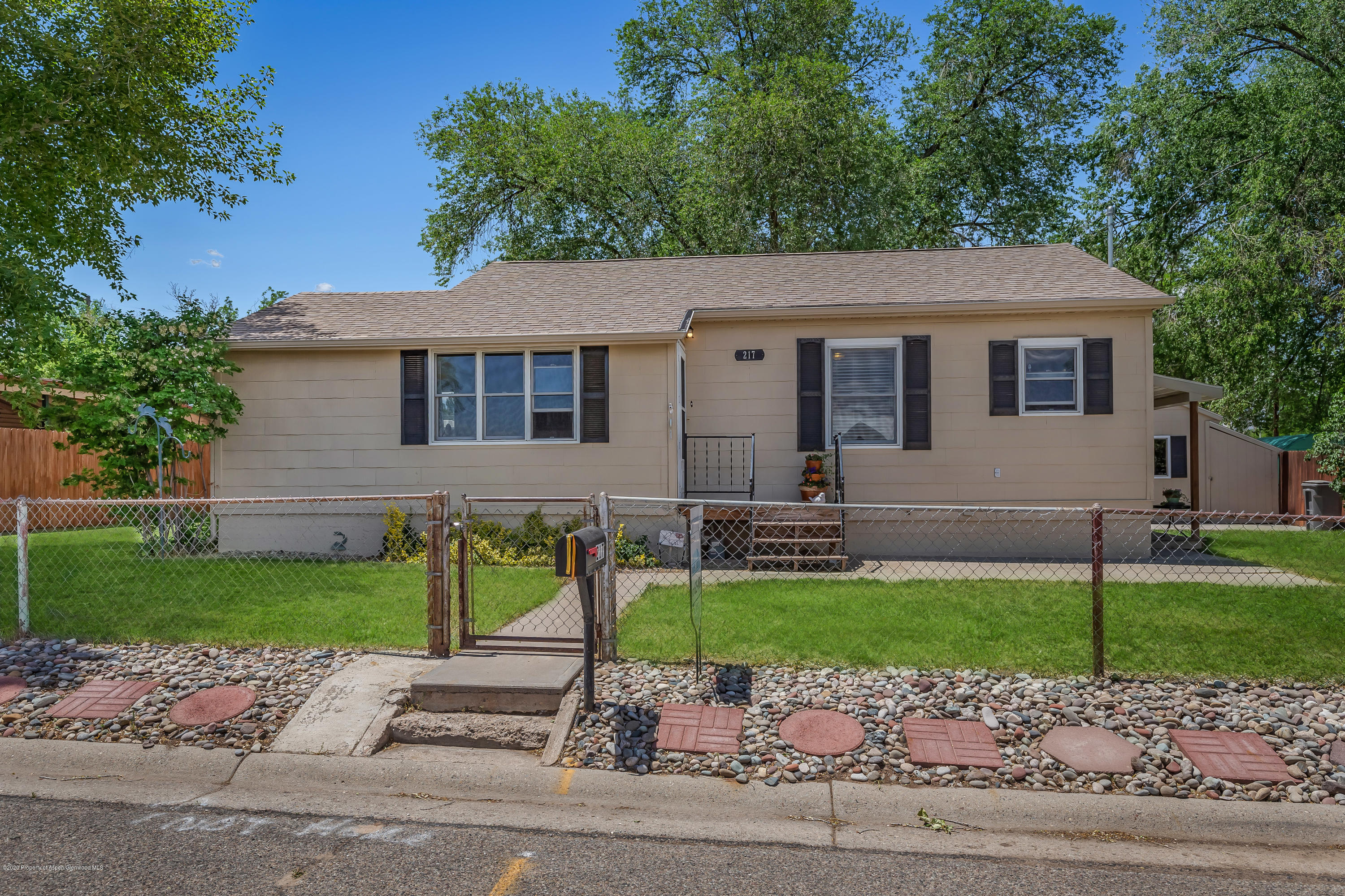 217 Ash Avenue Rifle, CO 81650 - Photo 2 of 25 a front view of house with yard and green space