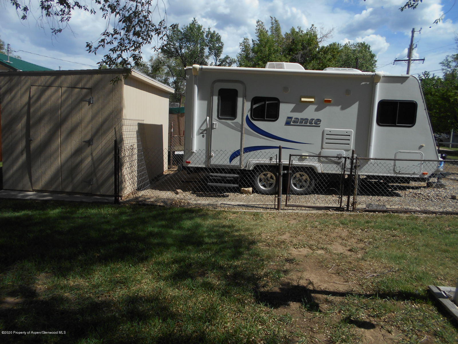 217 Ash Avenue Rifle, CO 81650 - Photo 22 of 25 a view of a back yard of the house