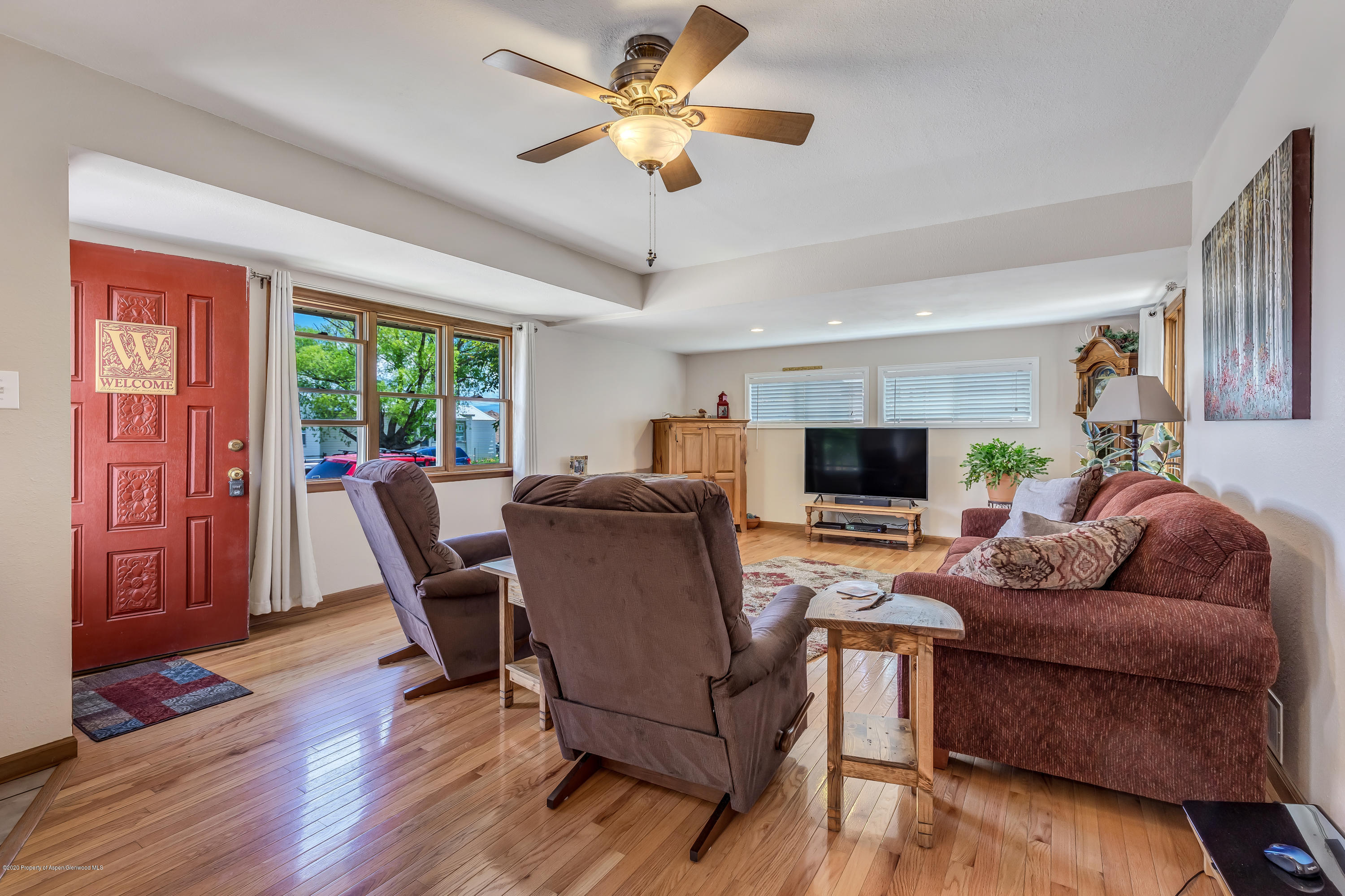 217 Ash Avenue Rifle, CO 81650 - Photo 5 of 25 a living room with furniture and a flat screen tv