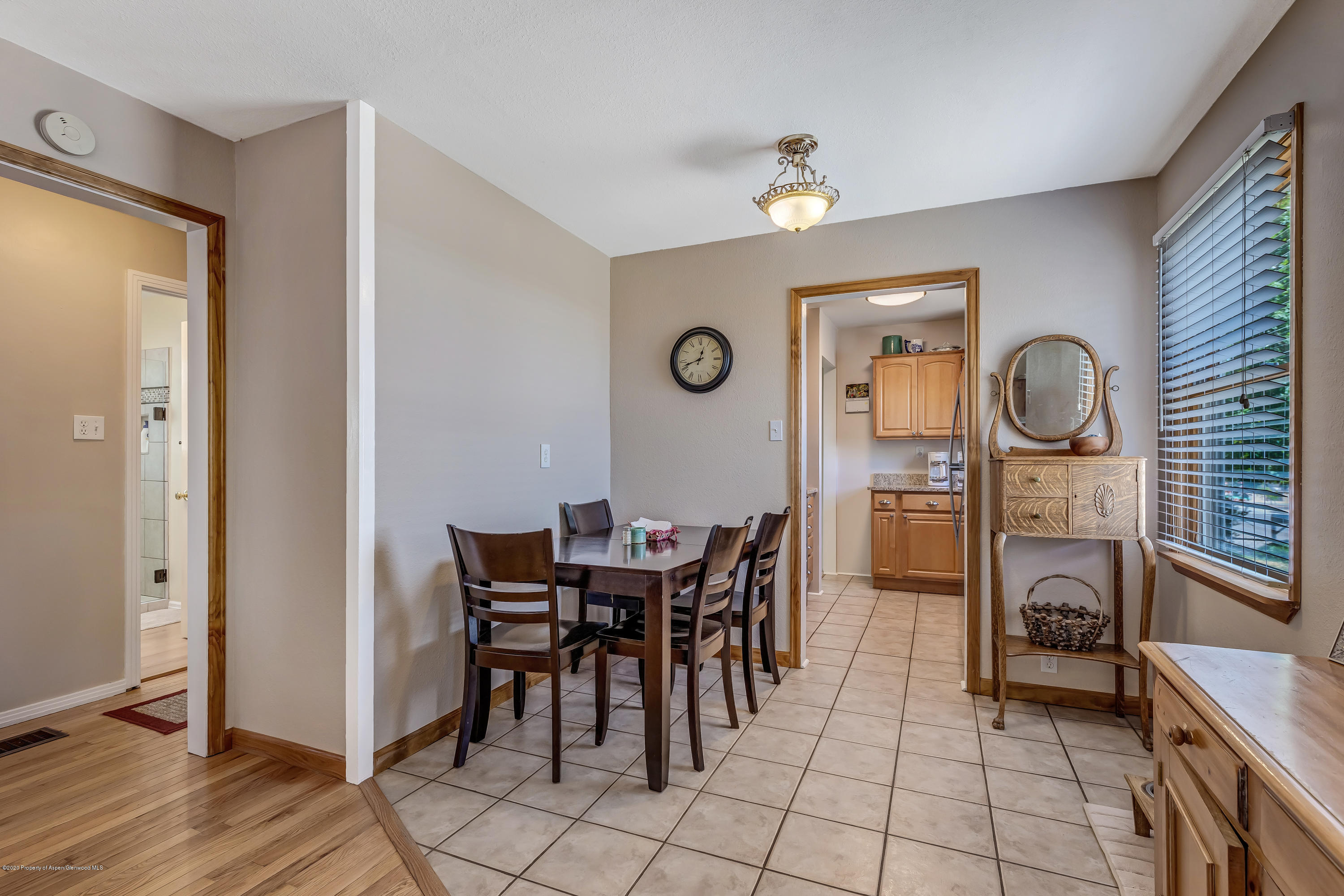 217 Ash Avenue Rifle, CO 81650 - Photo 8 of 25 a view of a dining room with furniture and chandelier